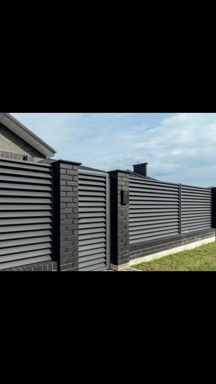 Close-up of louvered aluminum panel and mounting hardware