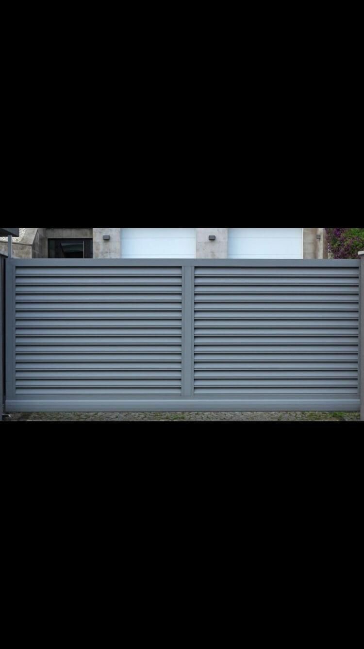 Precast concrete base with dark horizontal slatted panels