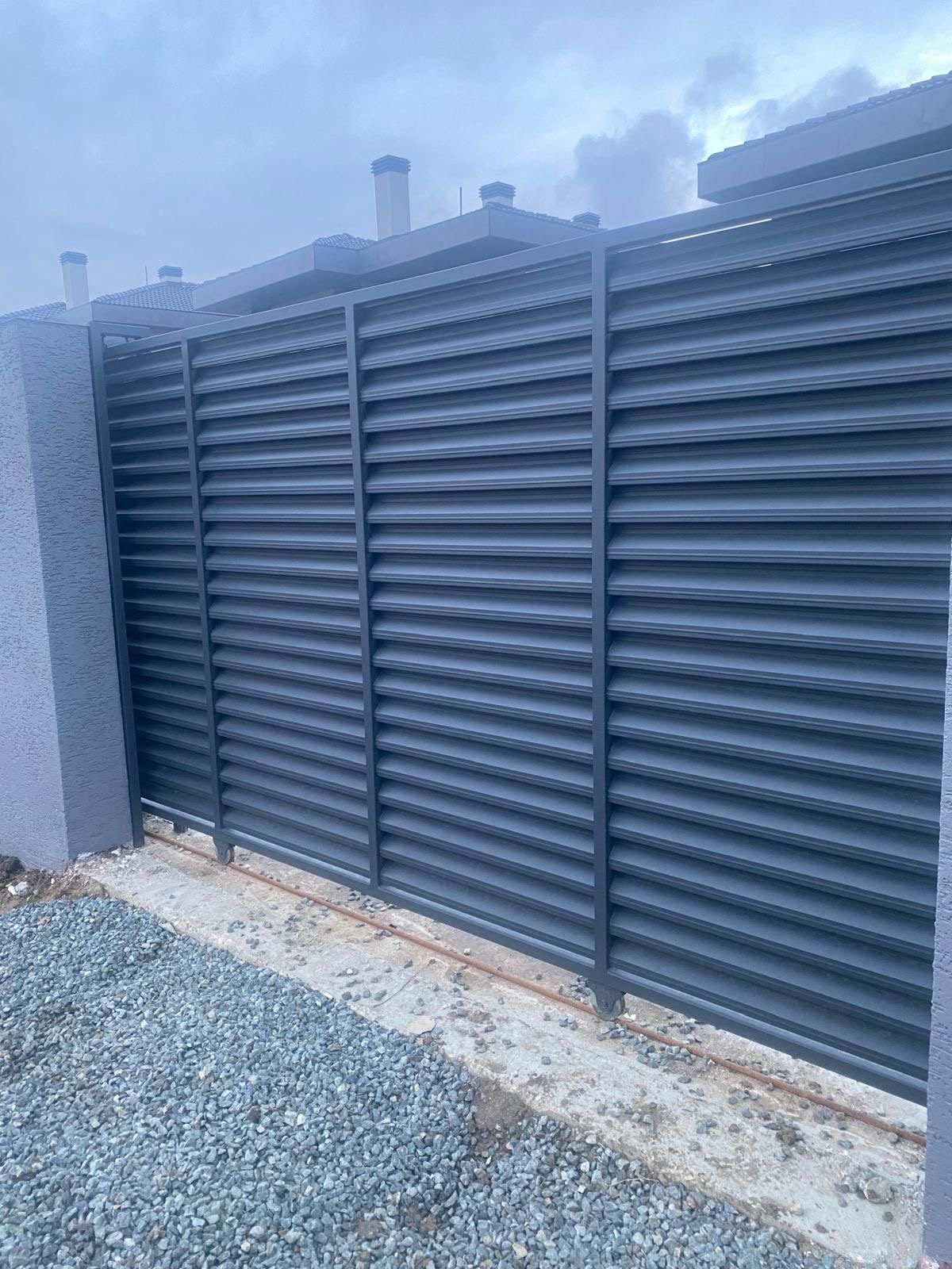 Villa with pool, glass balustrade and landscaped patio